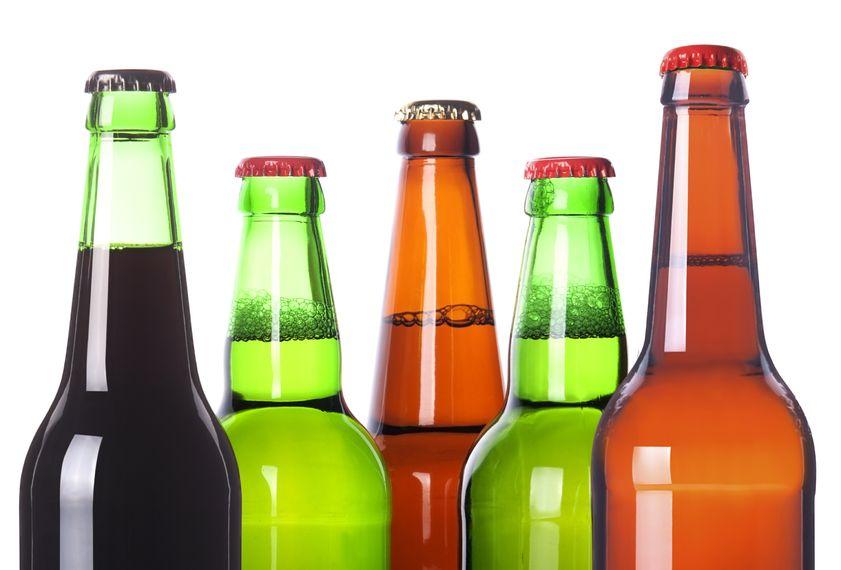 5 coloured glass cider bottles side by side